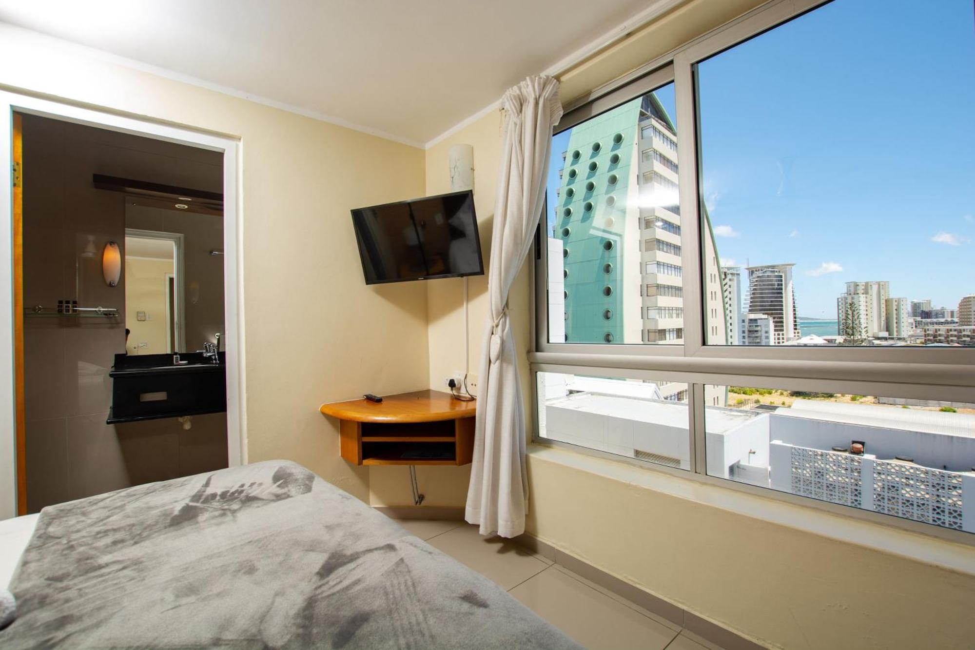 Ocean Breeze Hotel Strand Buitenkant foto